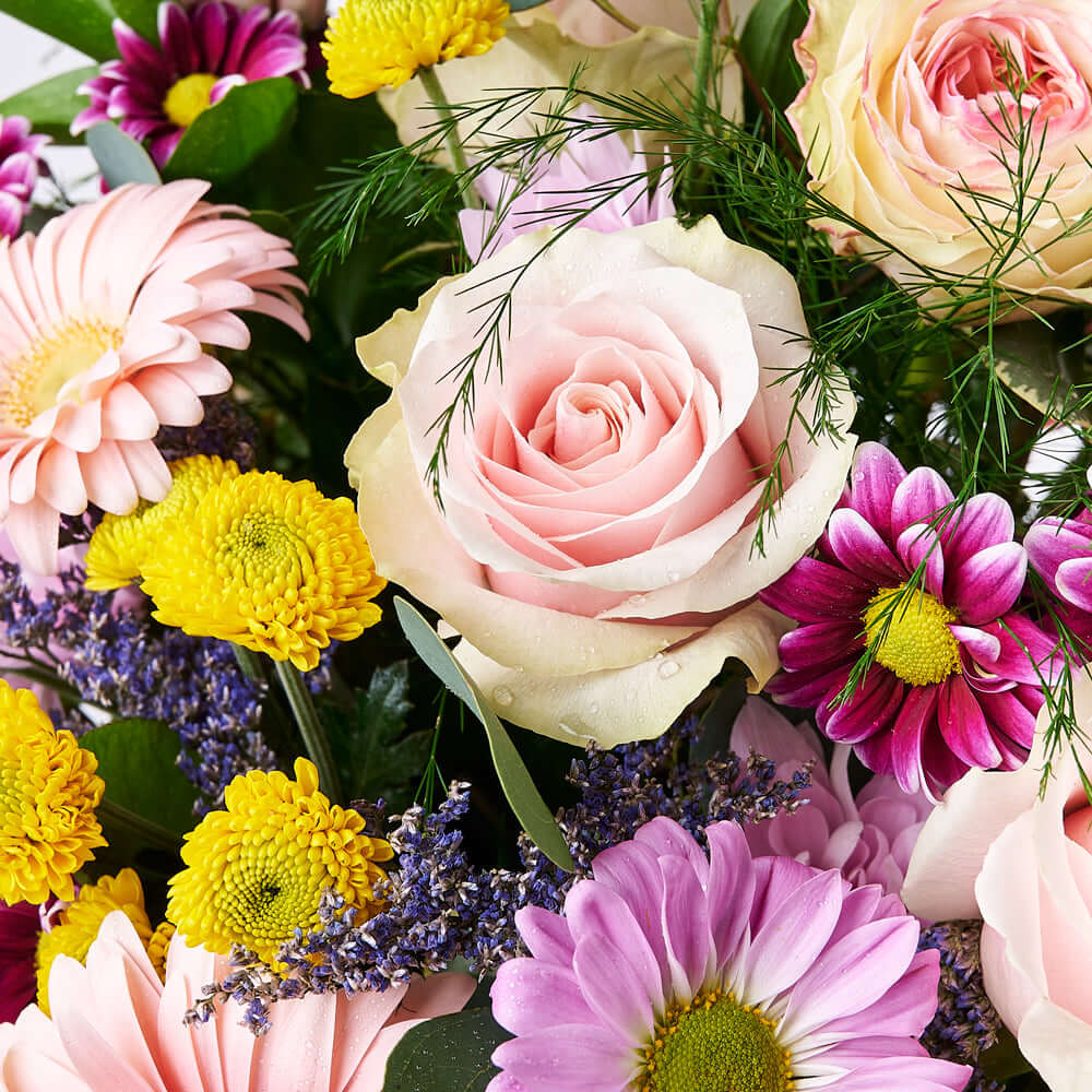 Premium Gourmet Gift Featuring Floral Arrangement in Tall Hat Box – how the gift is presented