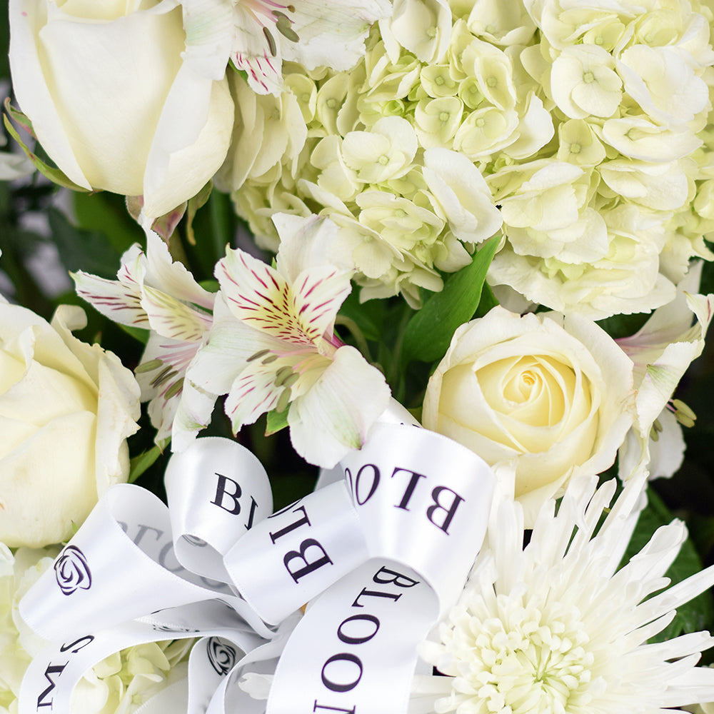 Occasion White Mixed Flower Arrangement with Plush and Chocolate – how the gift is presented