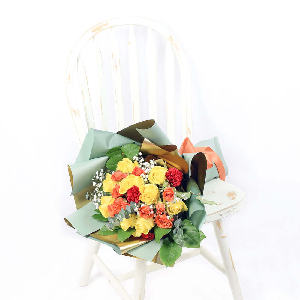 Vibrant Red, Yellow and Orange Rose Bouquet with Carnations – how the gift is presented