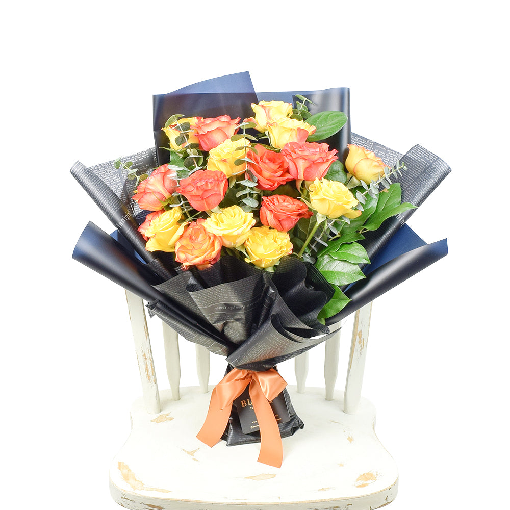 Deluxe 24-Stem Red, Yellow, and Orange Rose Bouquet – how the gift is presented