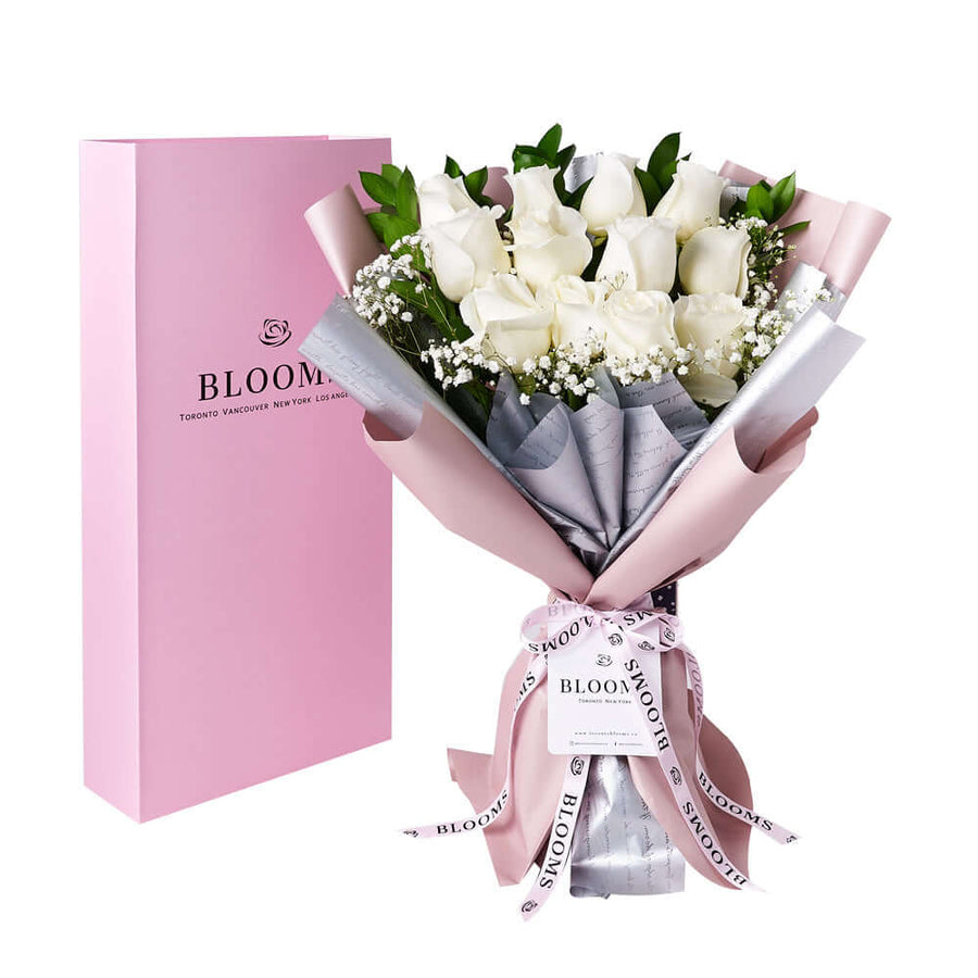 Gorgeous no matter the occasion, the Enduring White Rose Bouquet & Box comes with a beautiful bouquet of white roses in a floral wrap and a pink rose box for a lovely presentation and safe transport.
