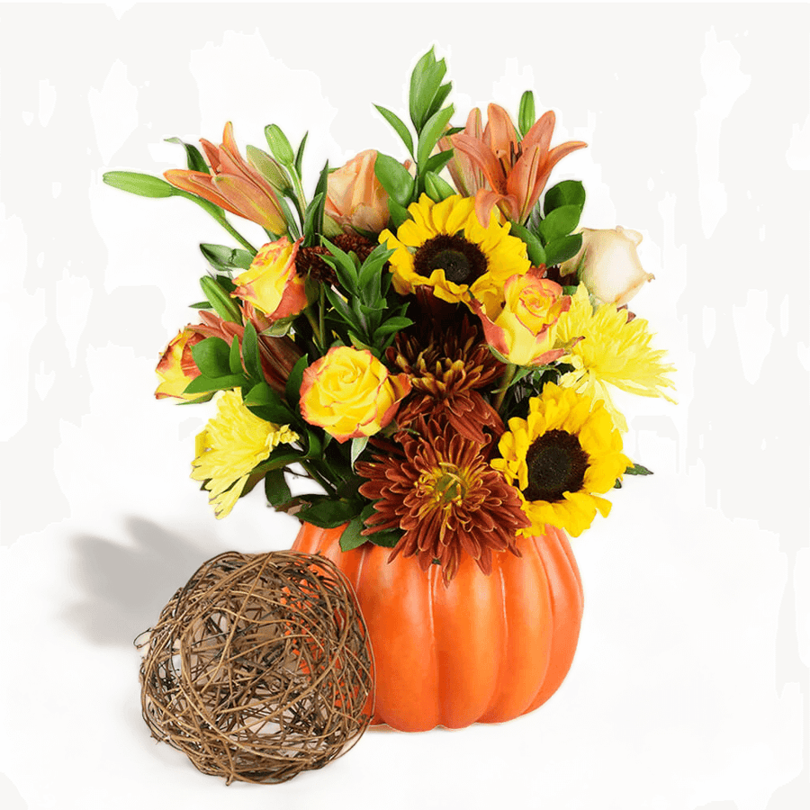 Connecticut Blooms features an array of flowers in beautifully warm fall tones of yellows and oranges in a cute pumpkin-shaped vase