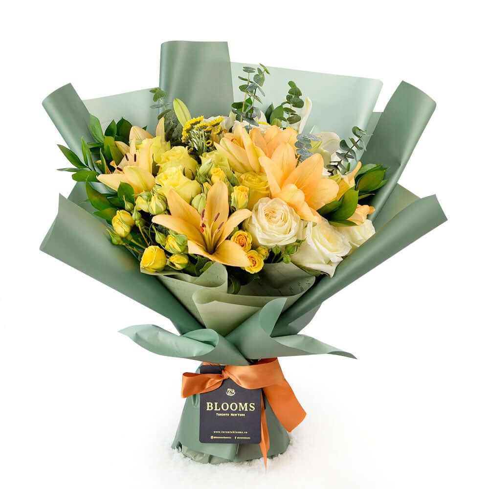 24-Stem Sunny Hues Floral Wrap Bouquet with Sparkling Wine – how the gift is presented
