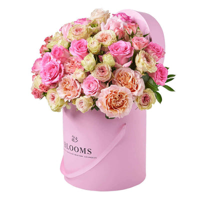 This large floral gift features pink and white roses gathered into a pink hat box for a wonderful way to breath of spring in any space. Connecticut Delivery