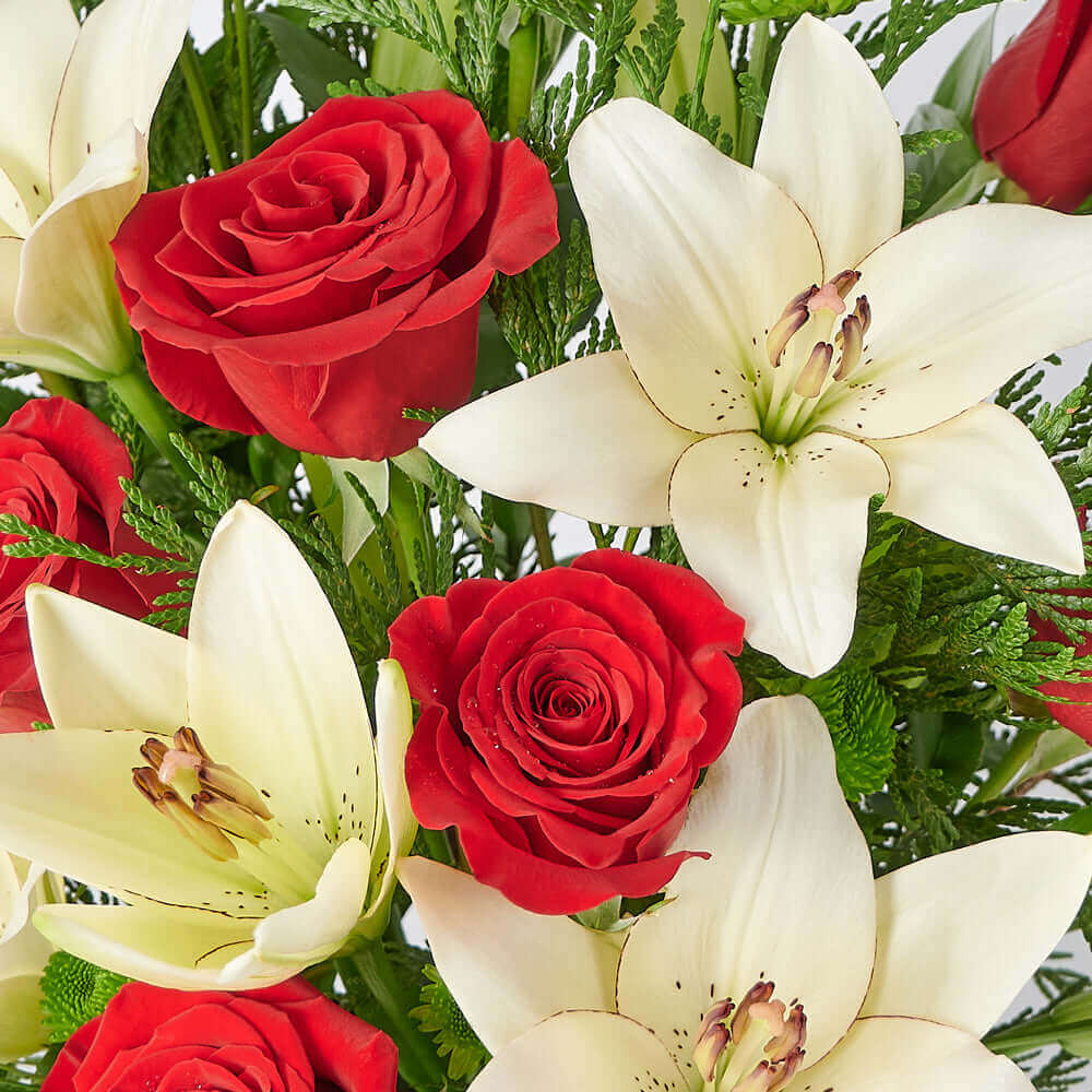 Festive Red Roses and White Lilies Flower Arrangement – how the gift is presented