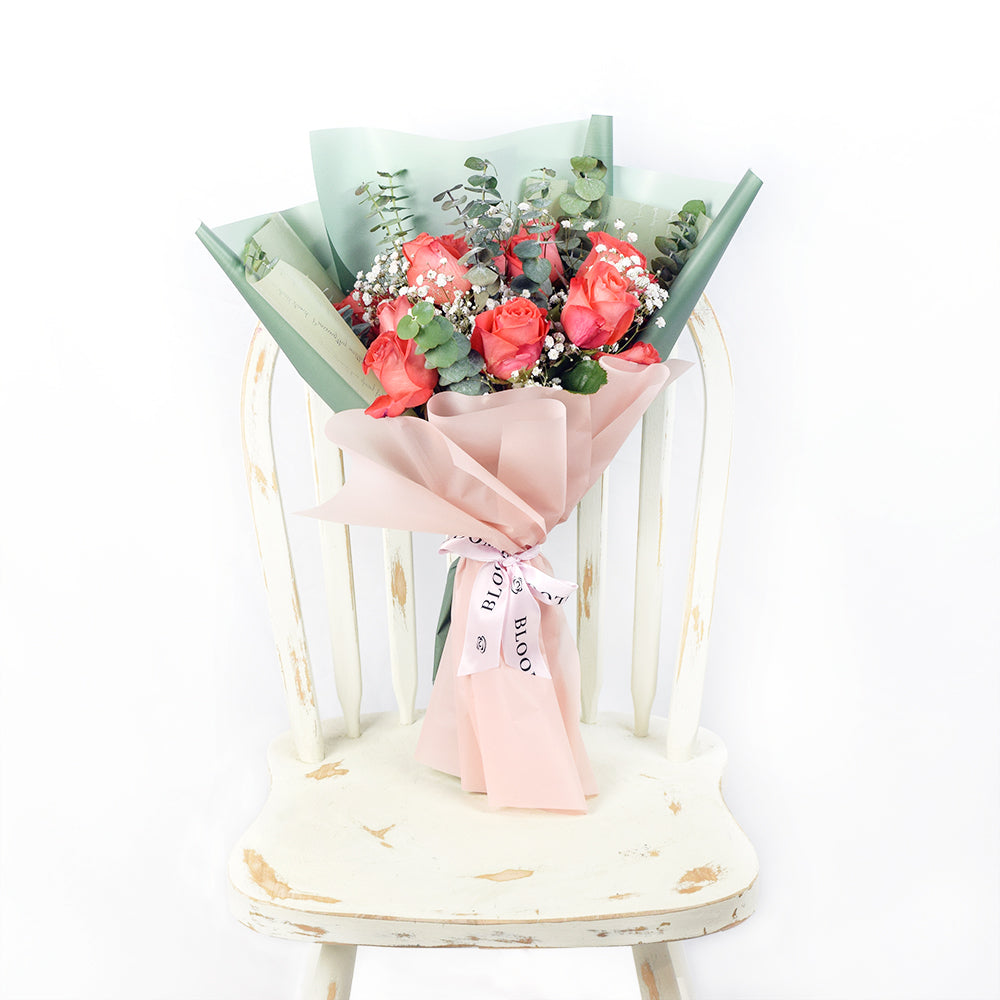 Elegant Coral Rose Bouquet with Eucalyptus Accent – how the gift is presented