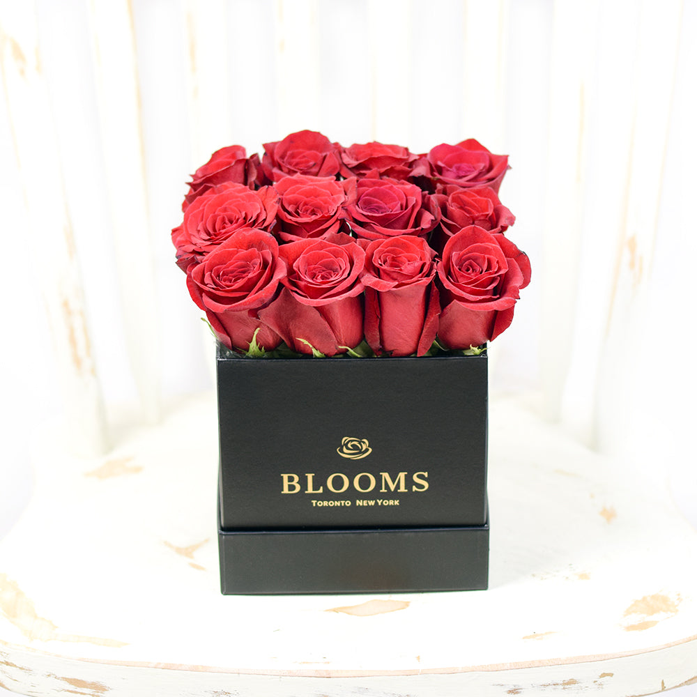 Vibrant Red Roses in Black Square Hat Box – how the gift is presented