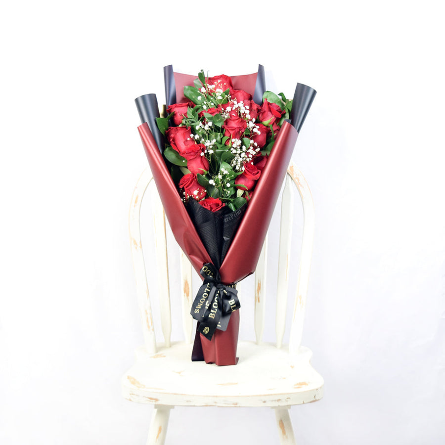 This bouquet includes a selection of deep red roses, baby’s breath, and ruscus gathered in floral wrap with designer ribbon. Connecticut Delivery