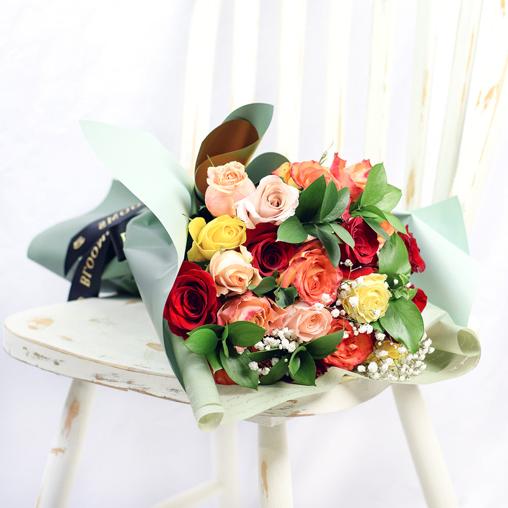 Bouquet with red, orange and yellow roses. Baby's breath and ruscus. Connecticut Delivery